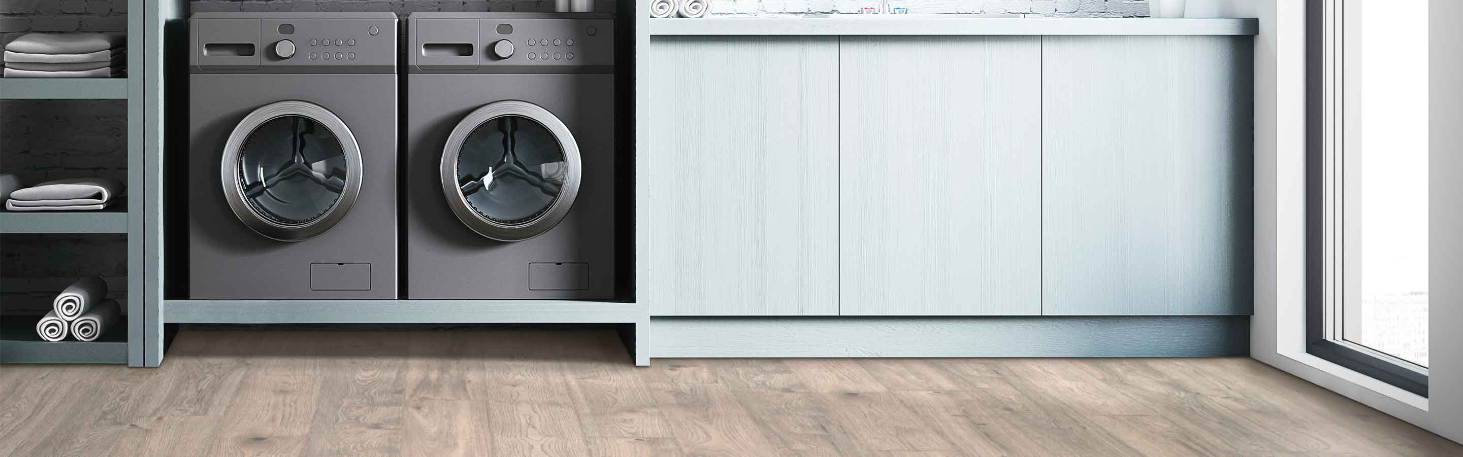 wood-look laminate flooring in laundry room with gray washer and dryer, shelving and sink